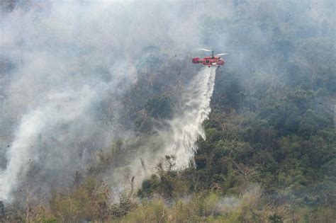 Thailand uses helicopters to fight mountain wildfires